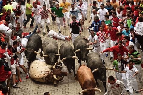 Bulls run - Participants run next to Miura fighting bulls on the last bullrun of the San Fermin festival in Pamplona, northern Spain, on July 12, 2019. Jaime Reina – AFP/Getty Images.